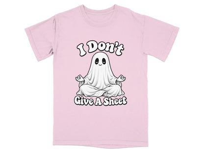 Pink t-shirt with a cartoon ghost meditating and text that reads "I Don't Give A Sheet".