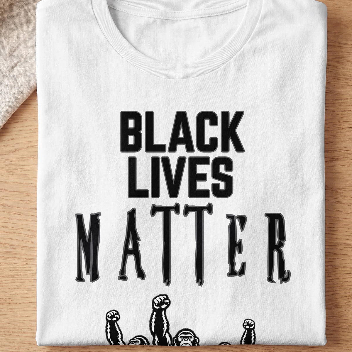 White t-shirt with black text "BLACK LIVES MATTER" and ape fists.