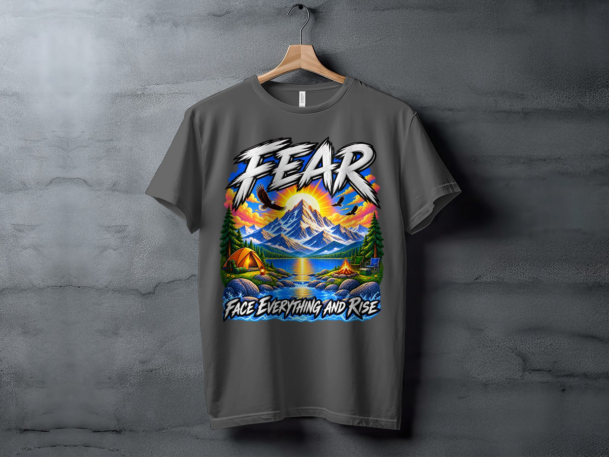 Graphic t-shirt with "FEAR FACE EVERYTHING AND RISE" text, mountains, tent, lake, and eagles.