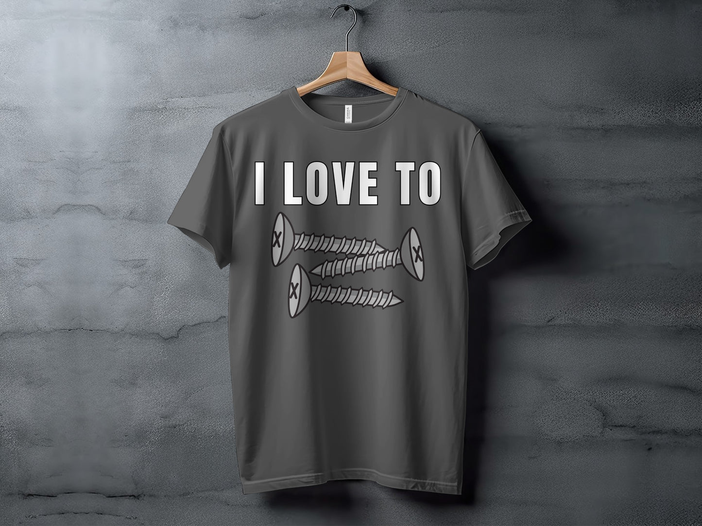 Dark grey t-shirt with white text "I LOVE TO" and three cartoon screws.