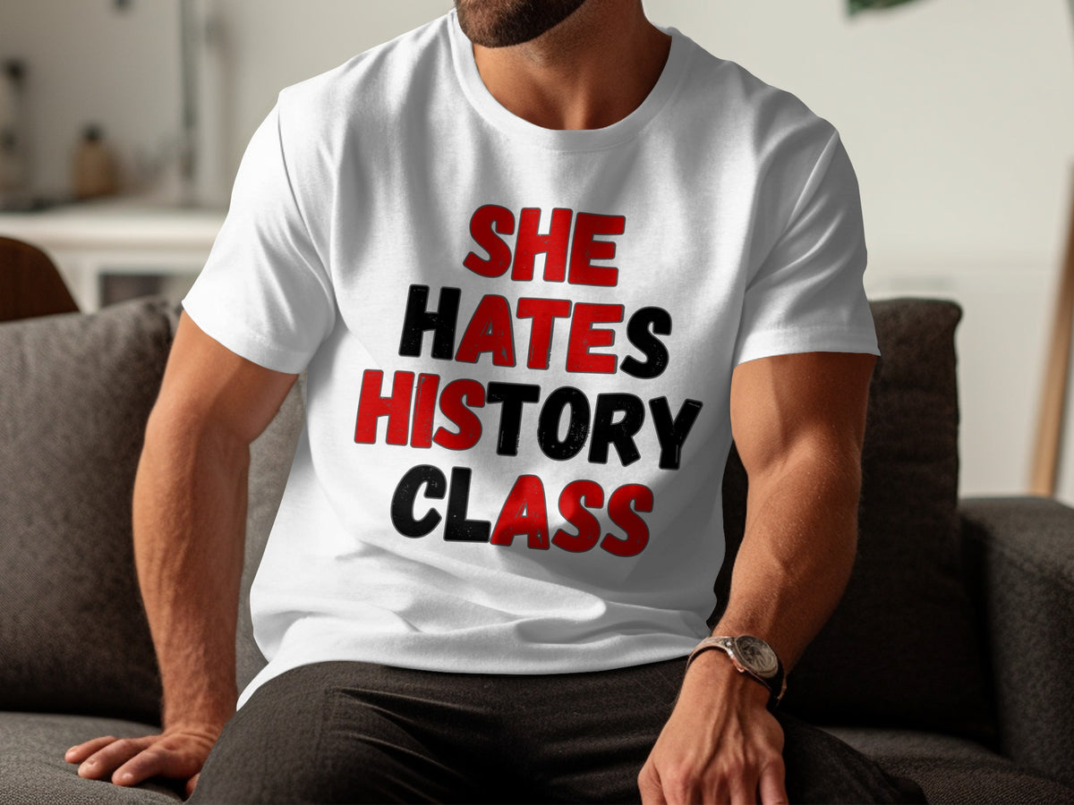White t-shirt with text "SHE HATES HISTORY CLASS" in red and black.