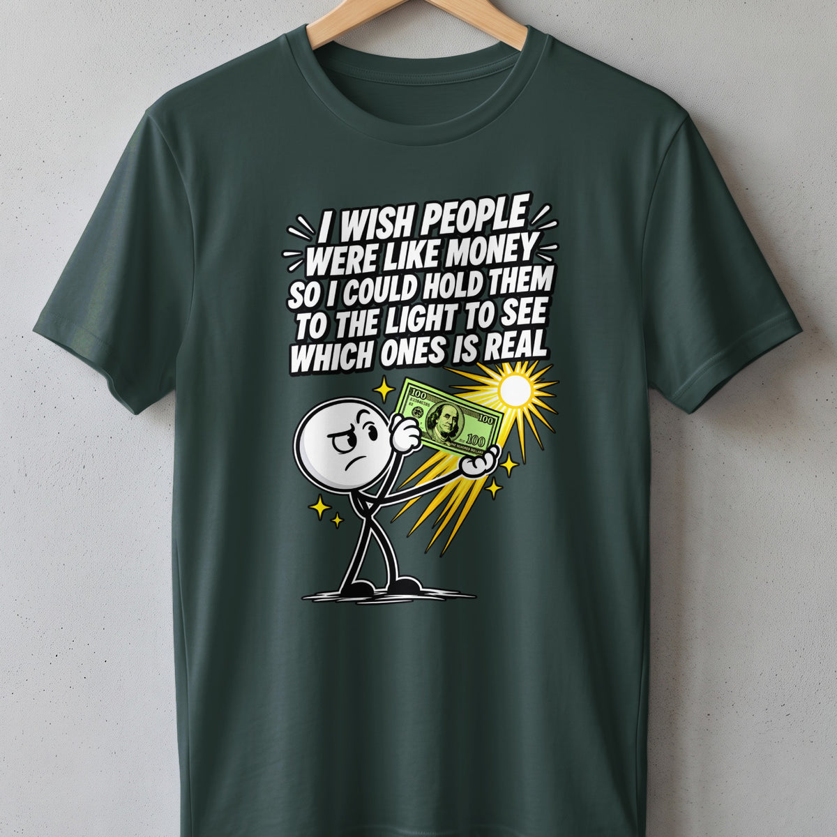 T-shirt with stick figure holding a $100 bill to the light with text.