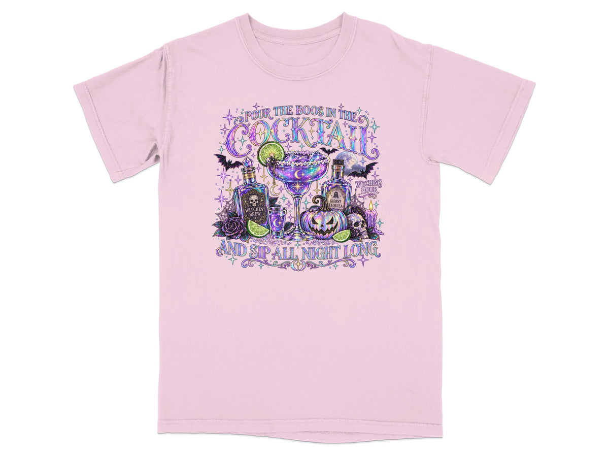 Pink t-shirt with Halloween cocktail illustration and text "Pour the Boos in the Cocktail and Sip All Night Long".