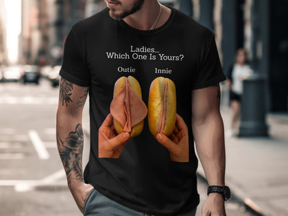 Black t-shirt with text "Ladies.... Which One Is Yours? Outie Innie" and two hotdog buns with deli meat.
