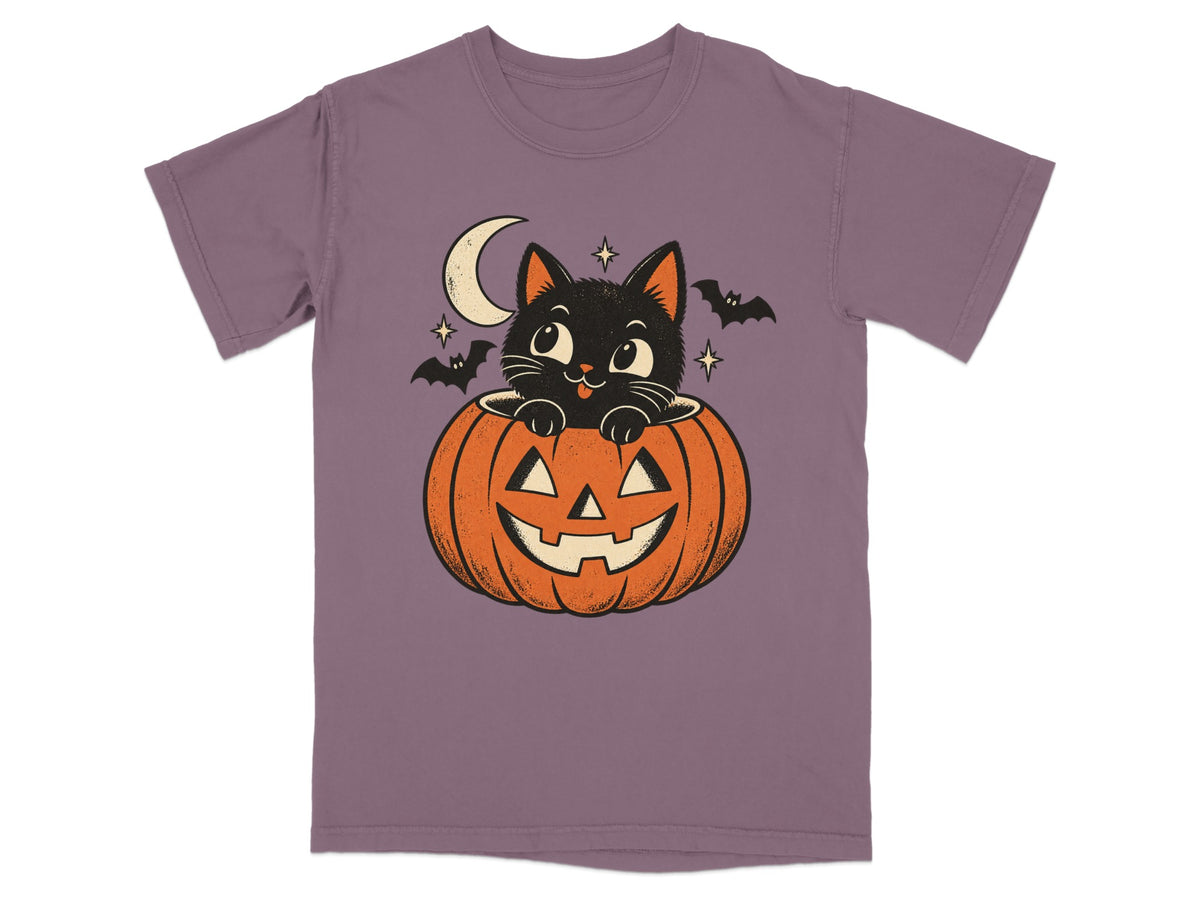Black cat peeking out of a jack-o'-lantern with bats and moon.