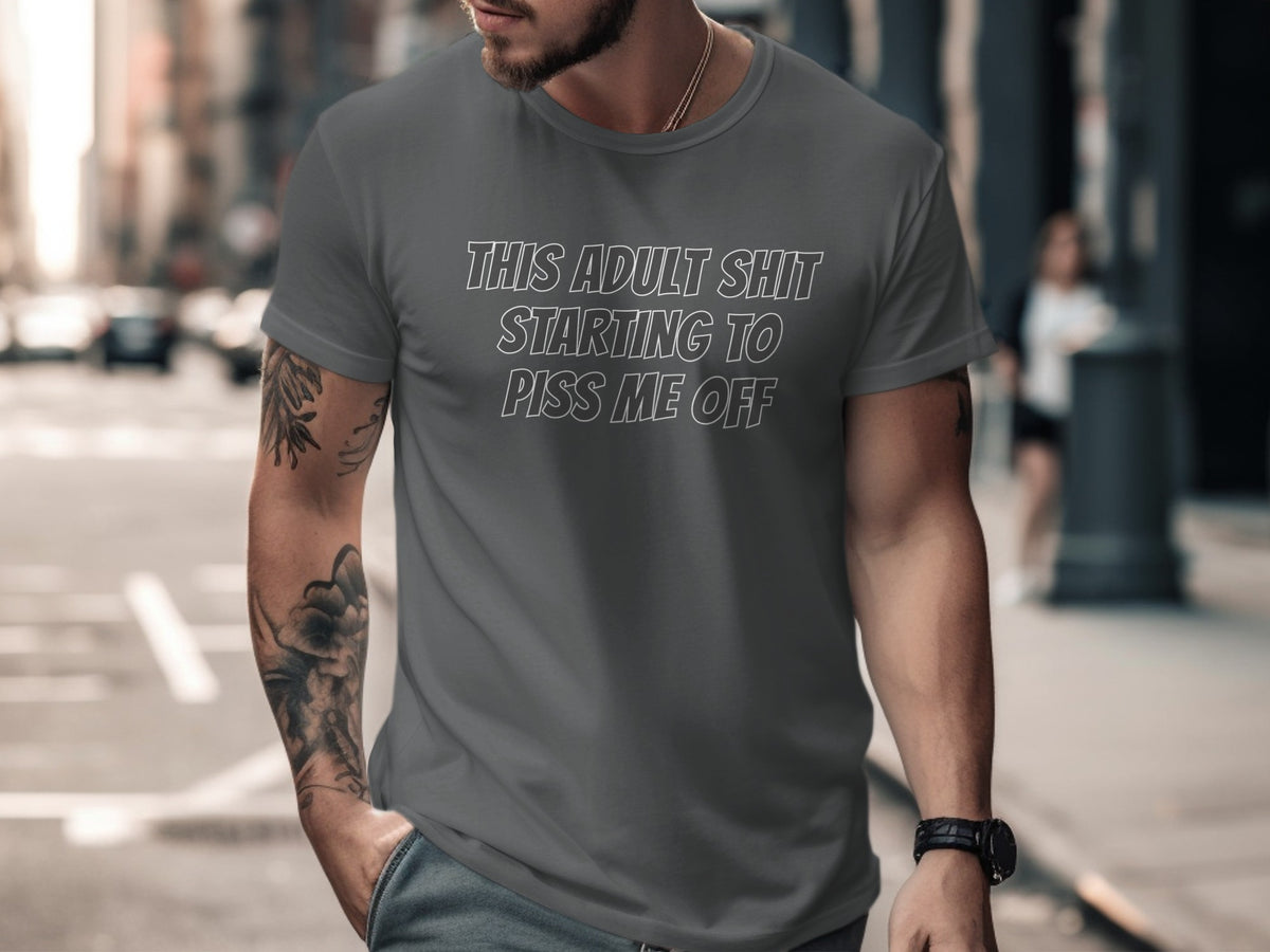 Grey t-shirt with white text "THIS ADULT SHIT STARTING TO PISS ME OFF".