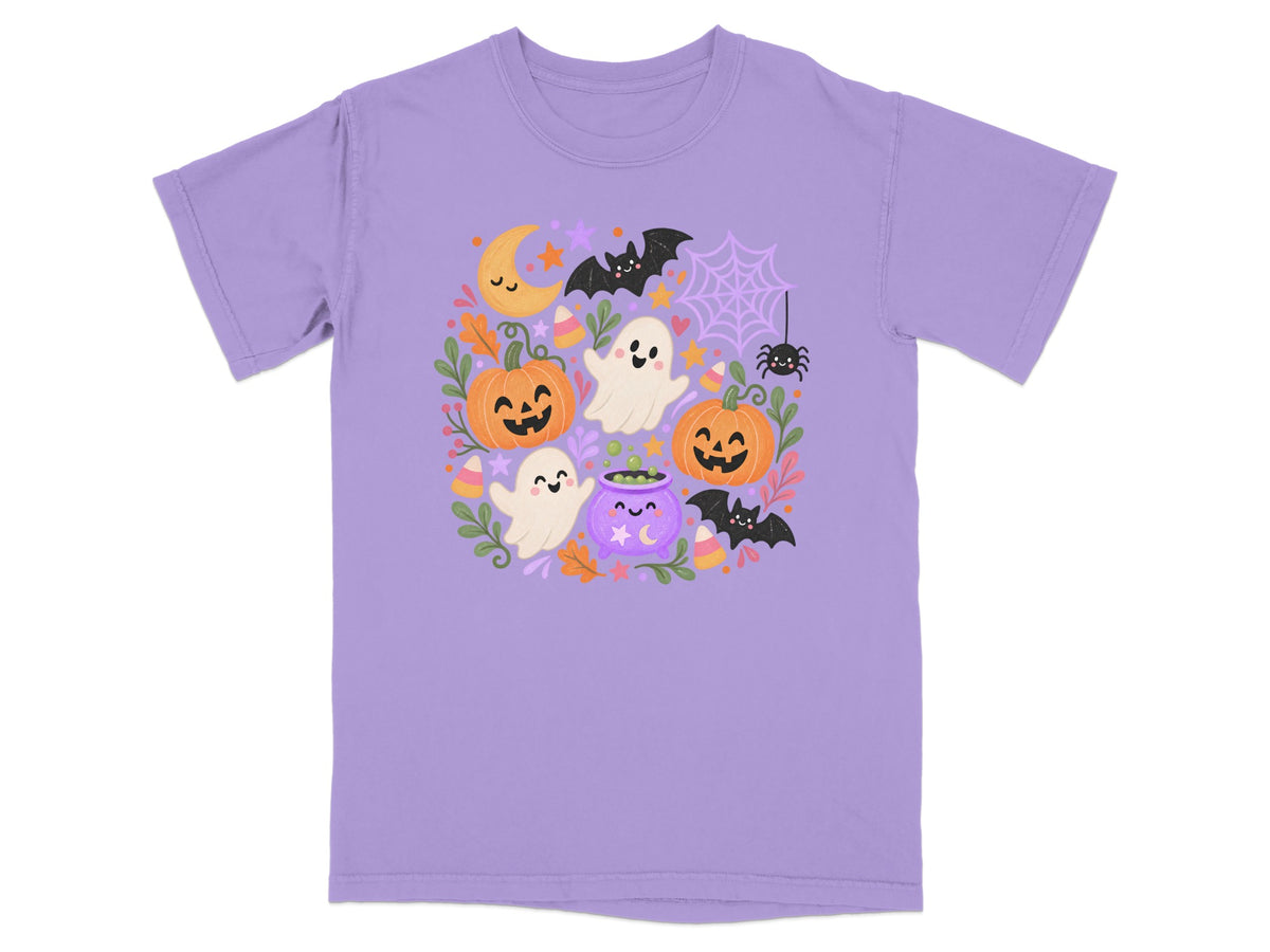 Lavender t-shirt with a playful Halloween graphic featuring ghosts, pumpkins, bats, and a cauldron.