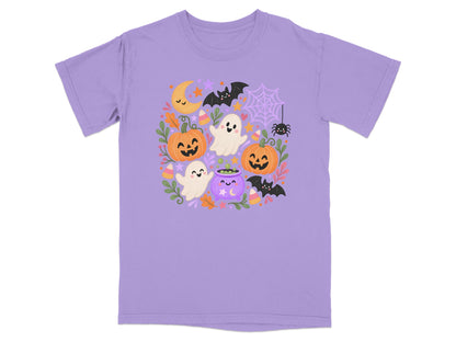 Lavender t-shirt with a playful Halloween graphic featuring ghosts, pumpkins, bats, and a cauldron.