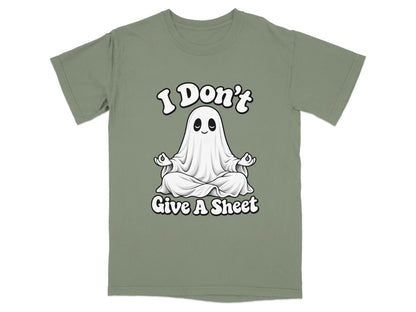 Green t-shirt with a cartoon ghost meditating and text "I Don't Give A Sheet".