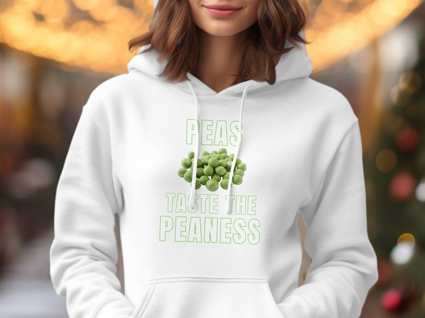 White hoodie with "Peas Taste the Peaness" graphic and illustration of peas.
