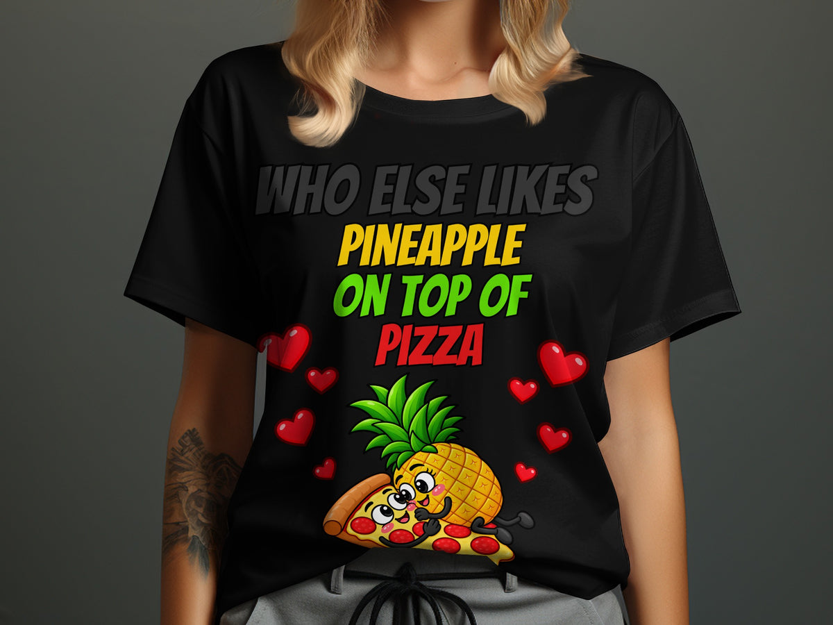 Black t-shirt with text "Who Else Likes Pineapple On Top Of Pizza" and cartoon.