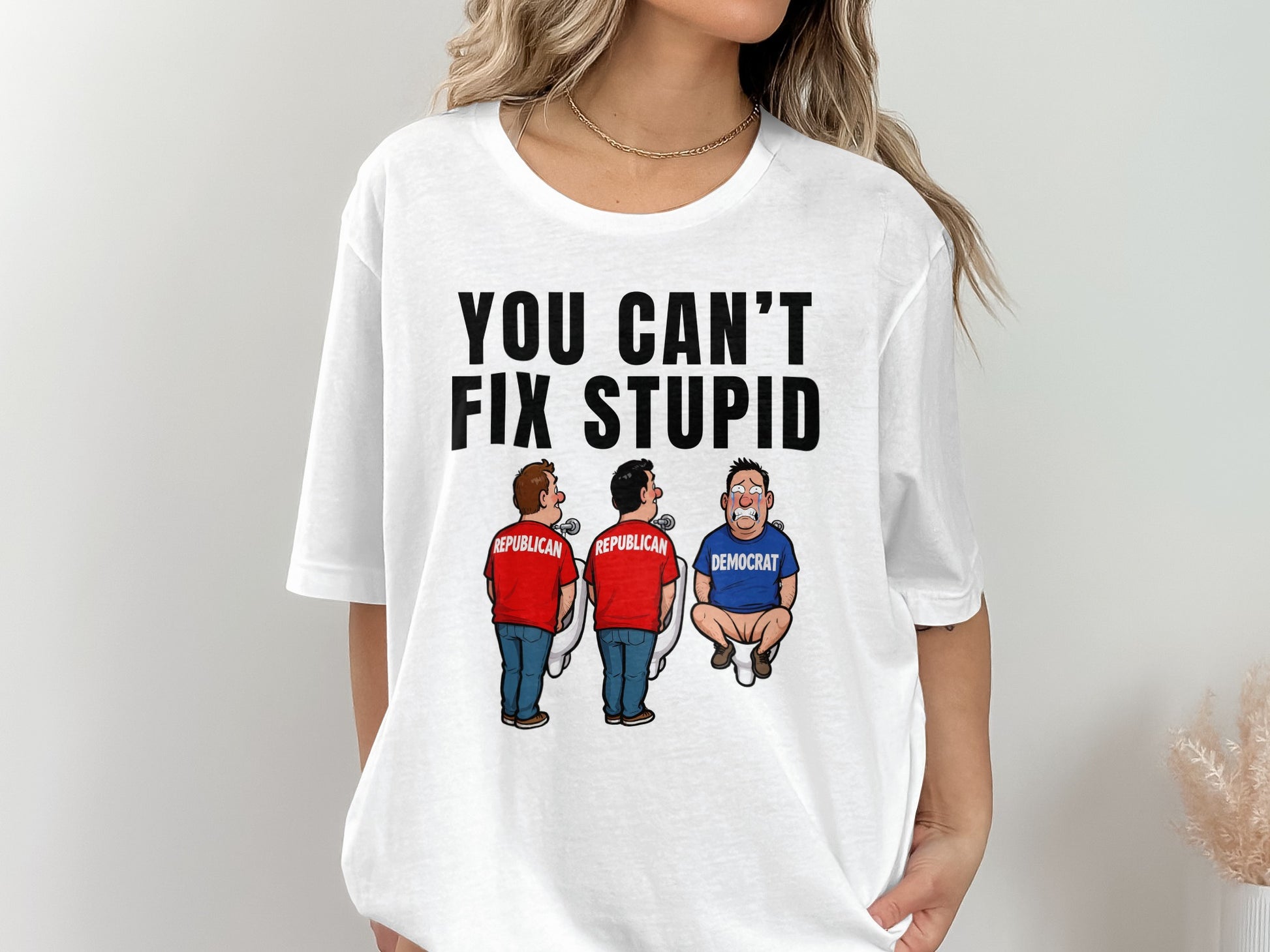 White t-shirt with "YOU CAN'T FIX STUPID" and cartoon of two Republicans and a crying Democrat.