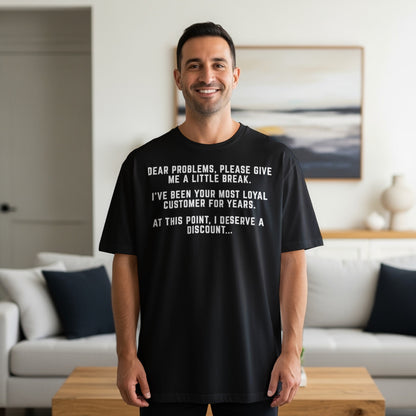 Black t-shirt with text: "Dear problems, please give me a little break."