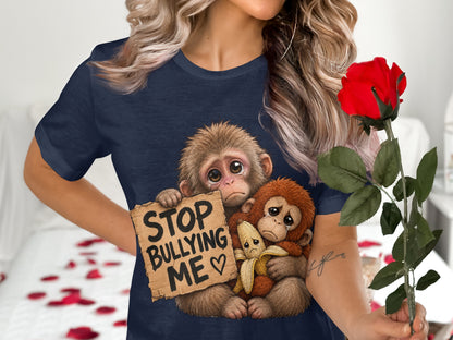 Two sad monkeys with a sign that says "STOP BULLYING ME ♡" on a navy blue shirt.