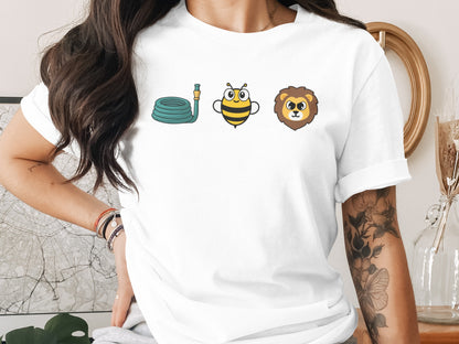 White t-shirt with cartoon garden hose, bee, and lion graphics.
