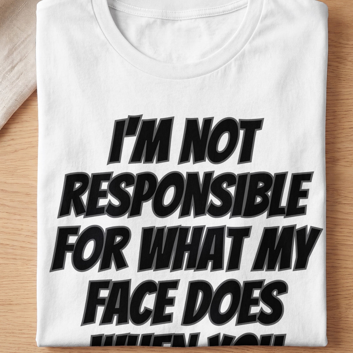 White t-shirt with black text "I'M NOT RESPONSIBLE FOR WHAT MY FACE DOES"