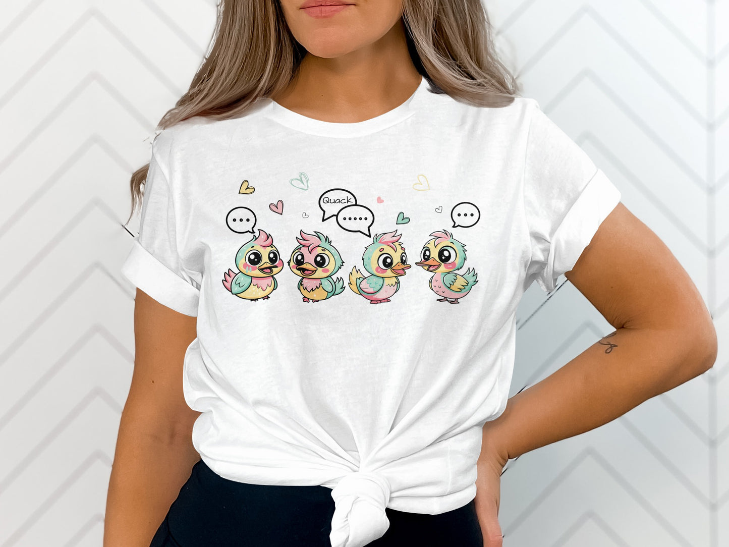Four cute cartoon chicks with speech bubbles on a white t-shirt.