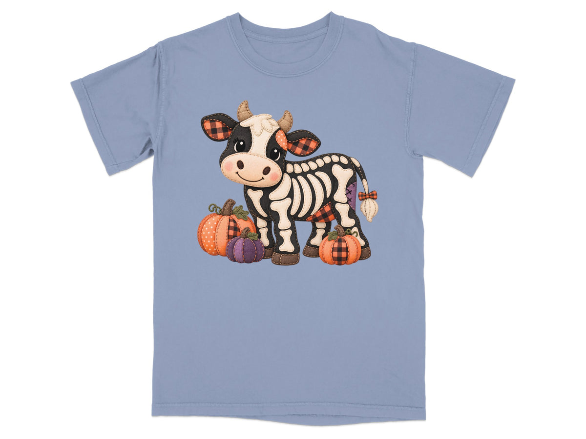 Skeleton cow with pumpkins on a blue t-shirt