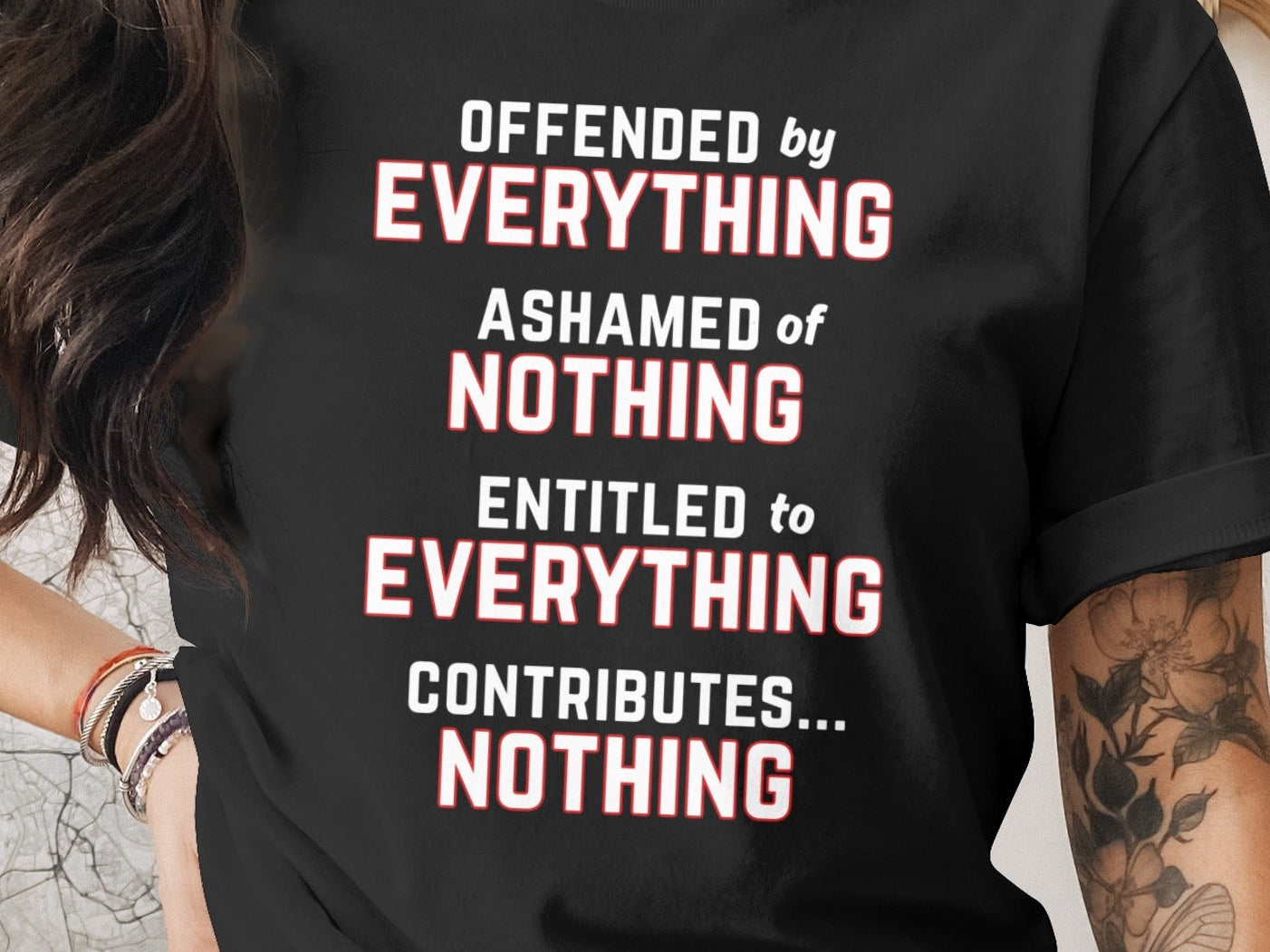 Black t-shirt with text: Offended by everything, ashamed of nothing, entitled to everything, contributes... nothing.