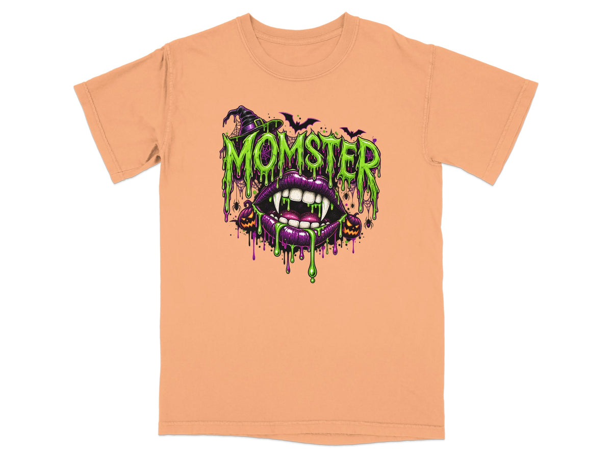 Orange t-shirt with "Momster" text, fangs, and Halloween graphics.