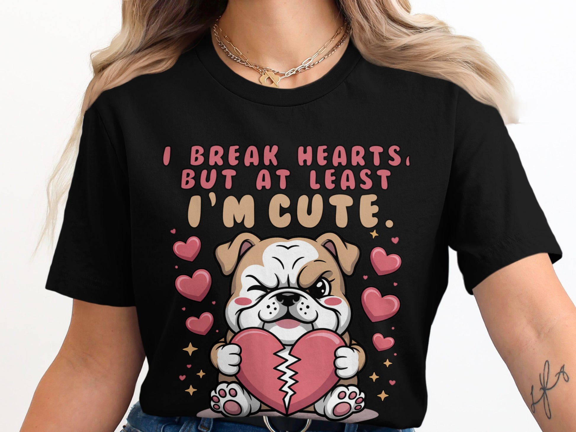Black shirt with graphic of bulldog holding broken heart, surrounded by hearts and stars.