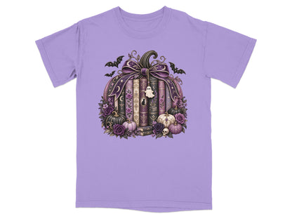 Purple t-shirt with a Halloween-themed pumpkin made of books, flowers, and bats.