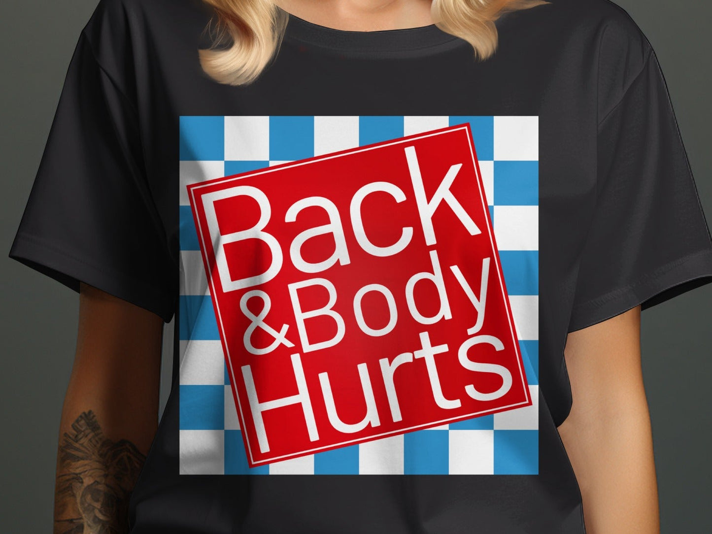 Black t-shirt with red square graphic saying "Back & Body Hurts" on blue checkerboard.