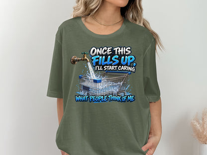 Graphic tee with text "Once this fills up, I'll start caring" and a shopping cart.