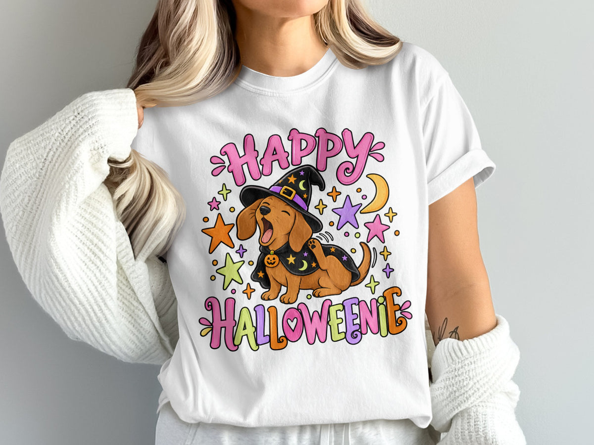 Dachshund in witch hat with "Happy Halloweenie" text, stars, and moon.