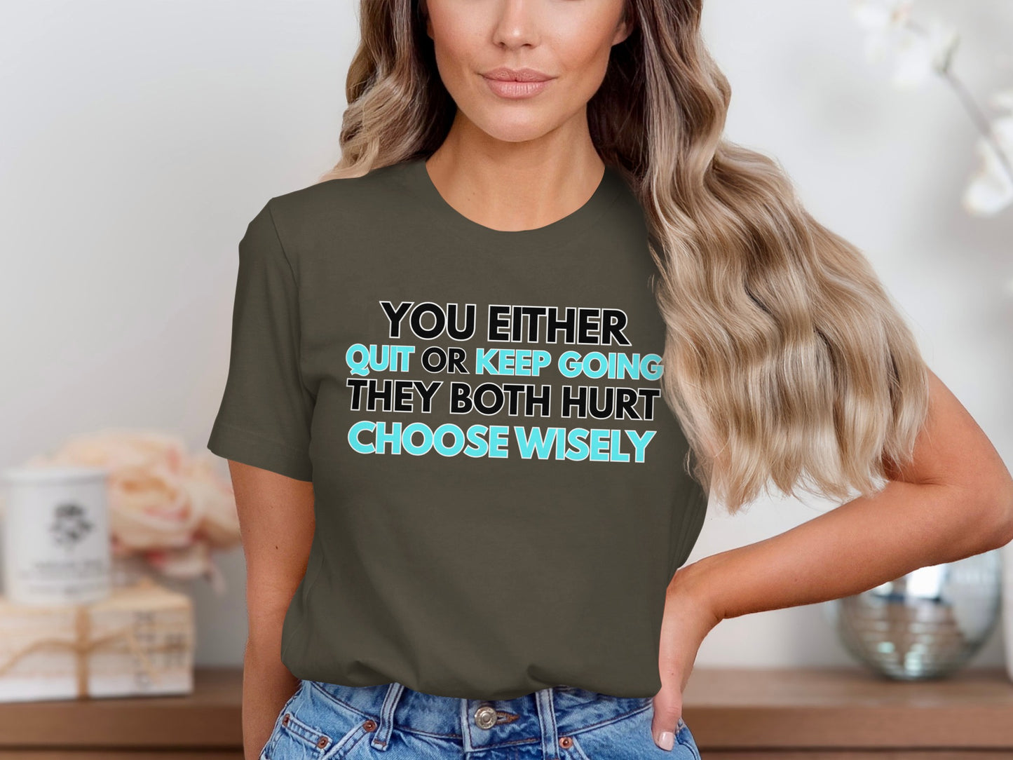 Dark t-shirt with text "You either quit or keep going, they both hurt. Choose wisely."