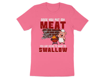 Pink t-shirt with cartoon pig grilling meat and text about putting meat in your mouth.