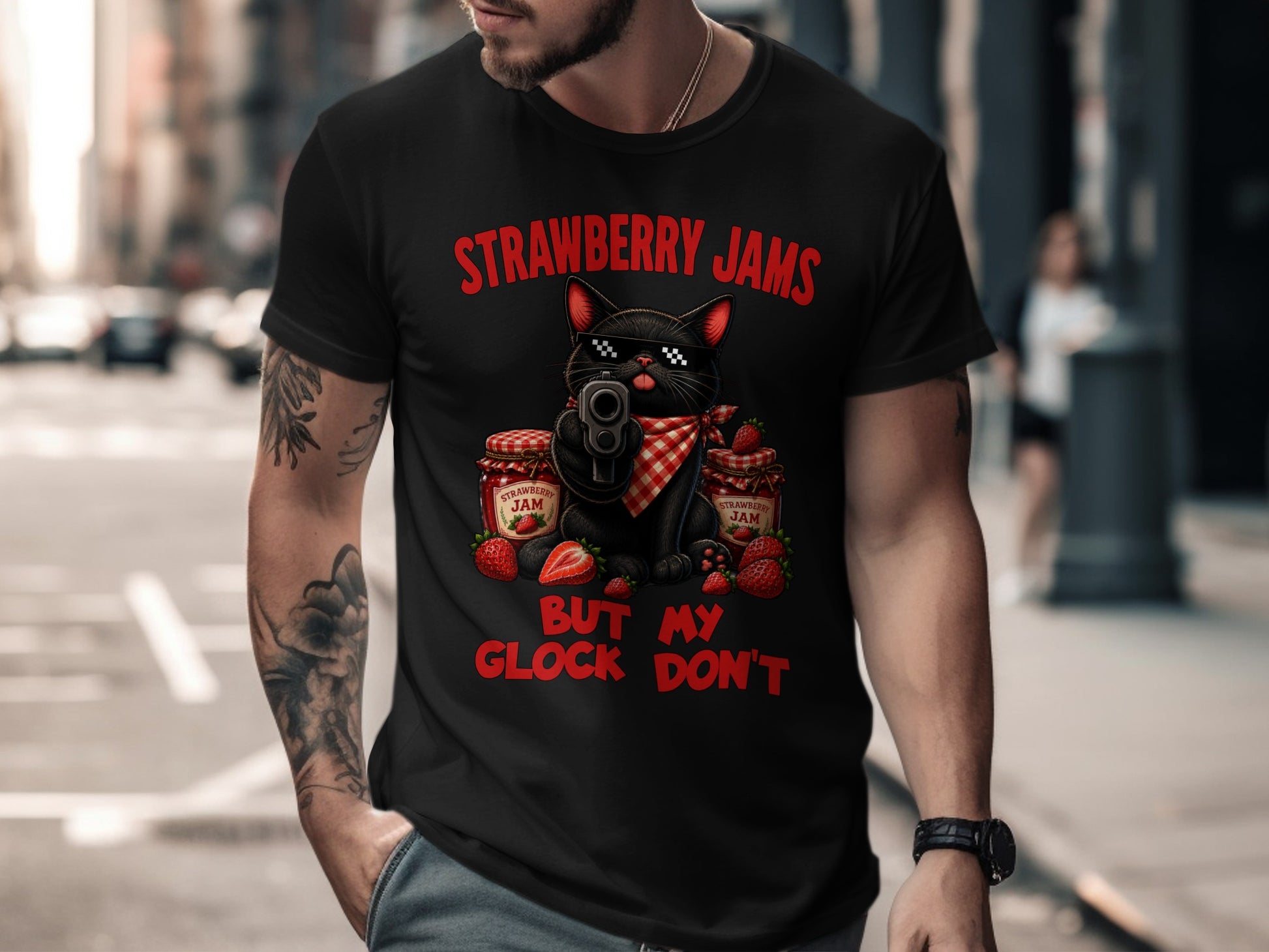 Black cat with sunglasses holding a gun with jars of strawberry jam and text "STRAWBERRY JAMS BUT MY GLOCK DON'T".