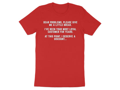 Red t-shirt with white text: "Dear problems, please give me a little break. I've been your most loyal customer for years. At this point, I deserve a discount..."
