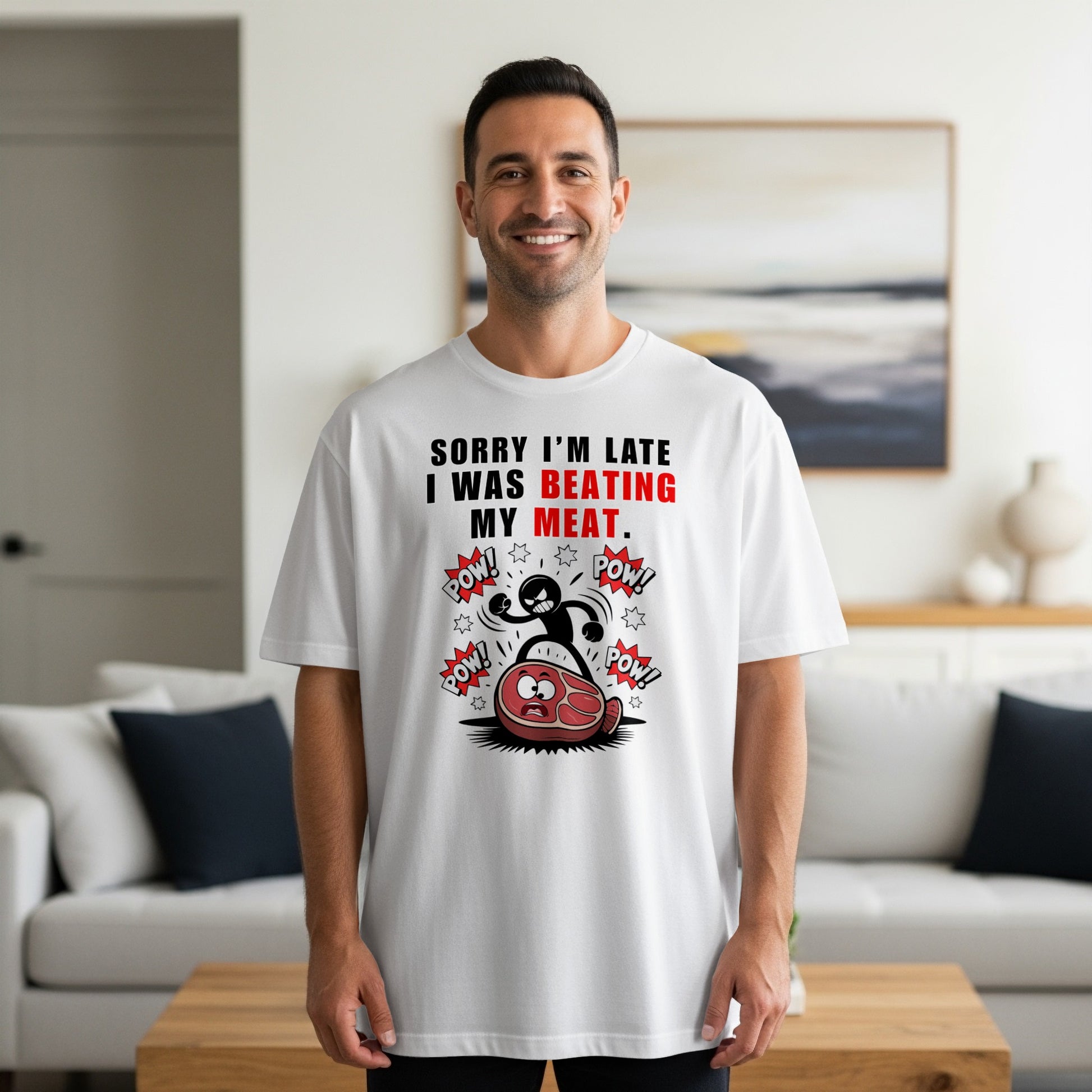 White t-shirt with "SORRY I'M LATE I WAS BEATING MY MEAT." graphic.
