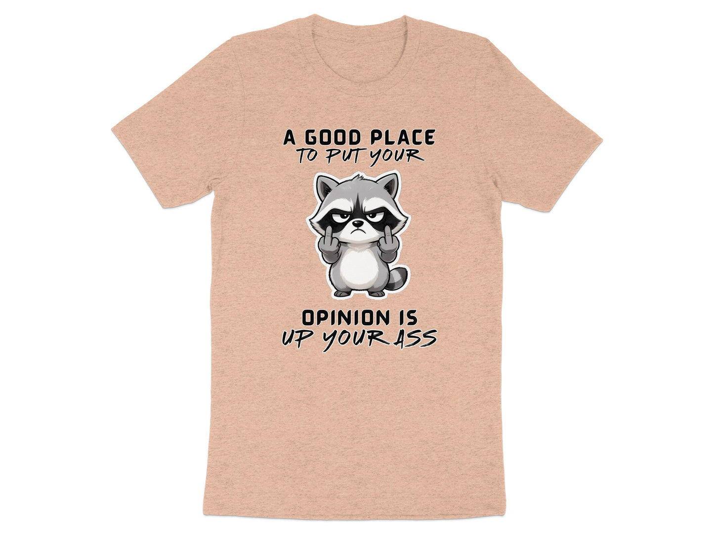Peach t-shirt with a grumpy raccoon giving the middle finger and text.