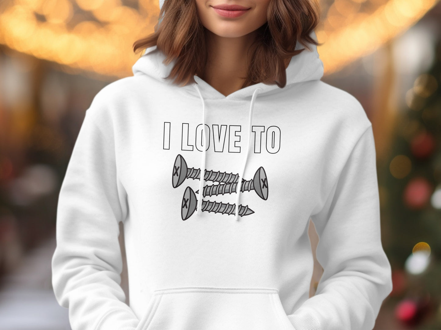 White hoodie with text "I LOVE TO" and three cartoon screws.