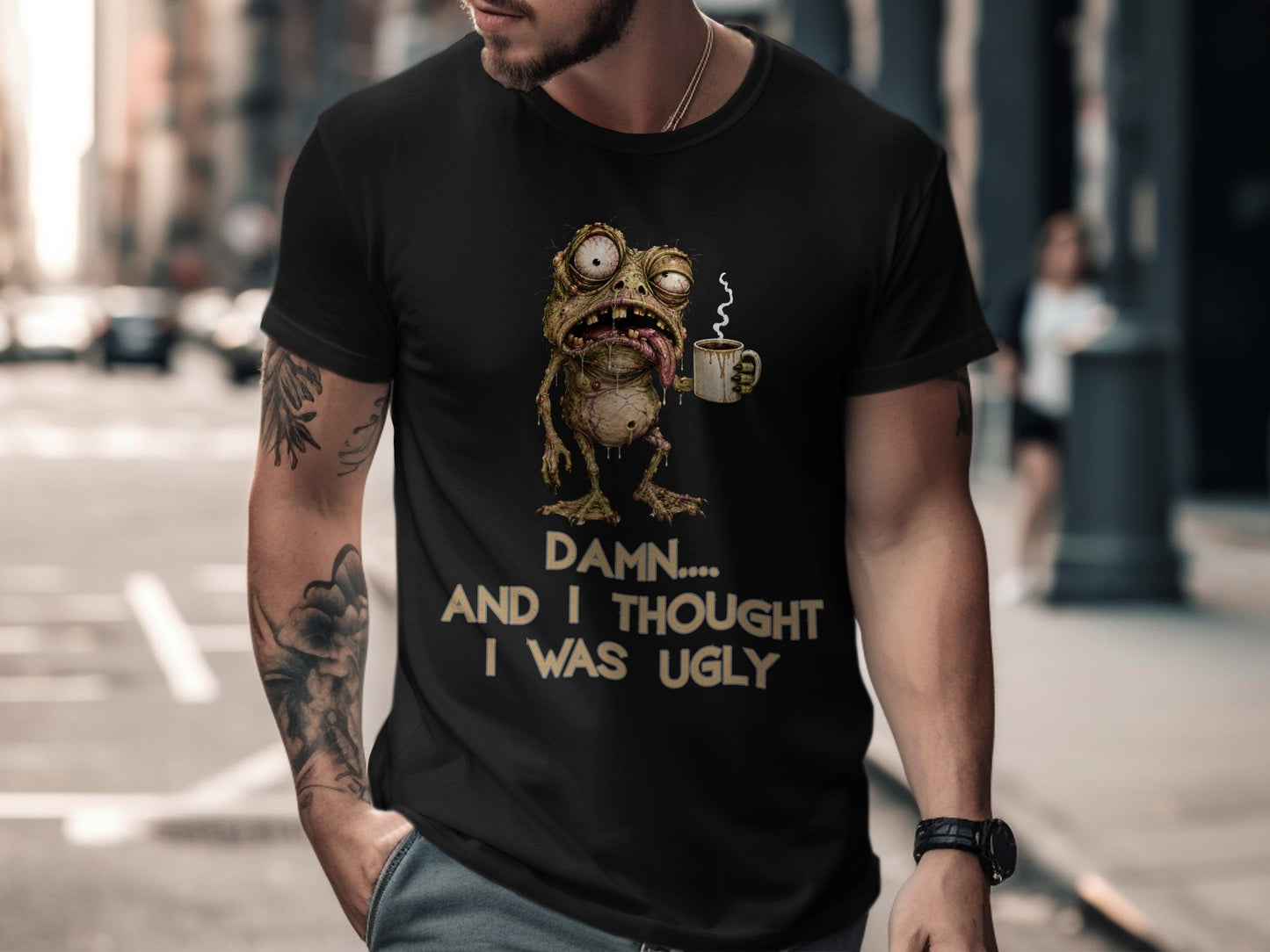 Black t-shirt with a cartoon frog holding coffee and text "Damn... And I thought I was ugly."