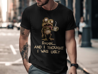Black t-shirt with a cartoon frog holding coffee and text "Damn... And I thought I was ugly."