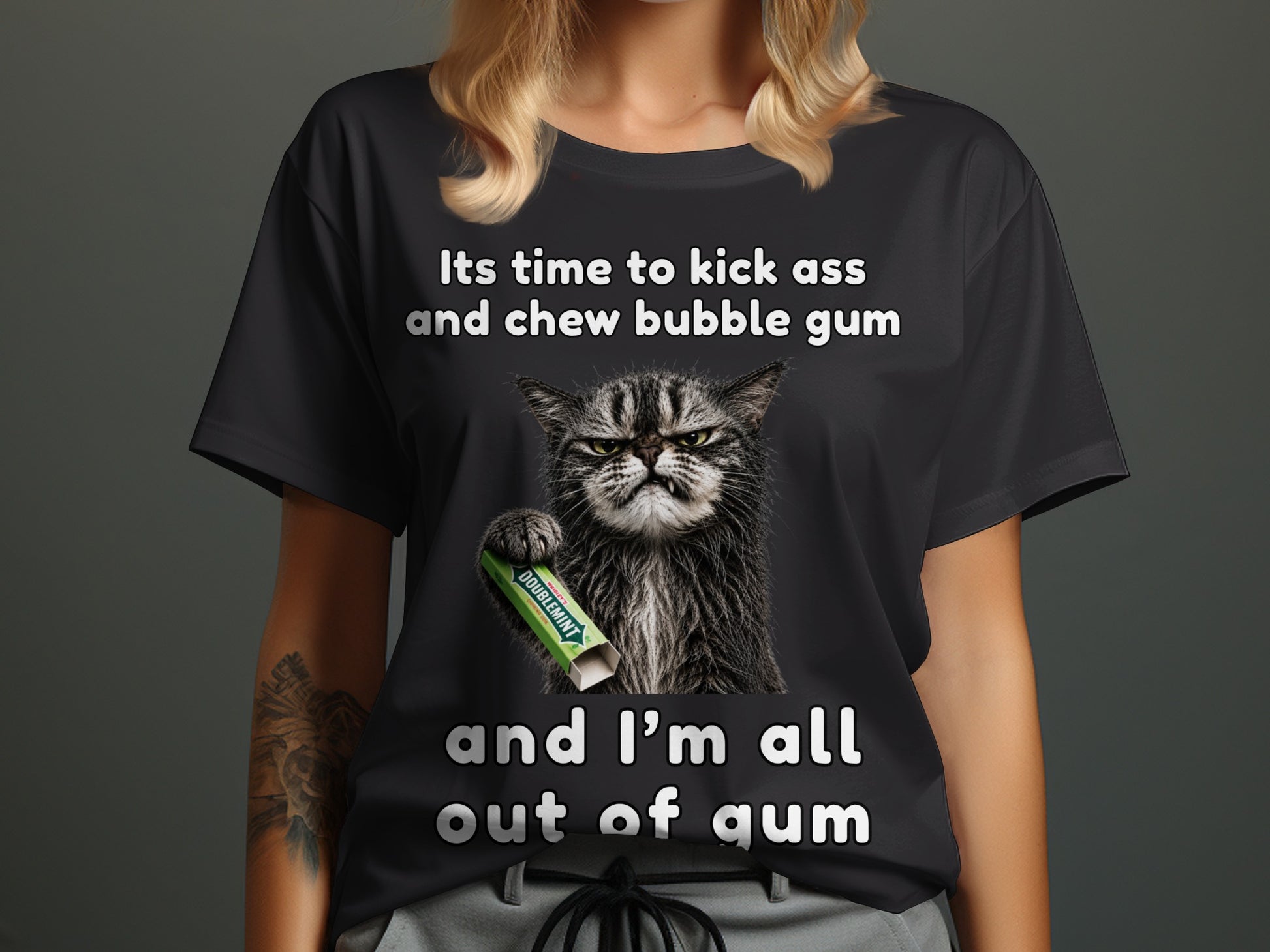 Black t-shirt with a cat holding bubble gum and the text "It's time to kick ass and chew bubble gum and I'm all out of gum".