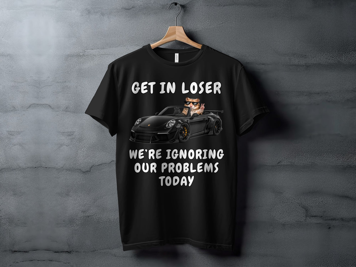 Black t-shirt with "GET IN LOSER WE'RE IGNORING OUR PROBLEMS TODAY" and a cat in a car.