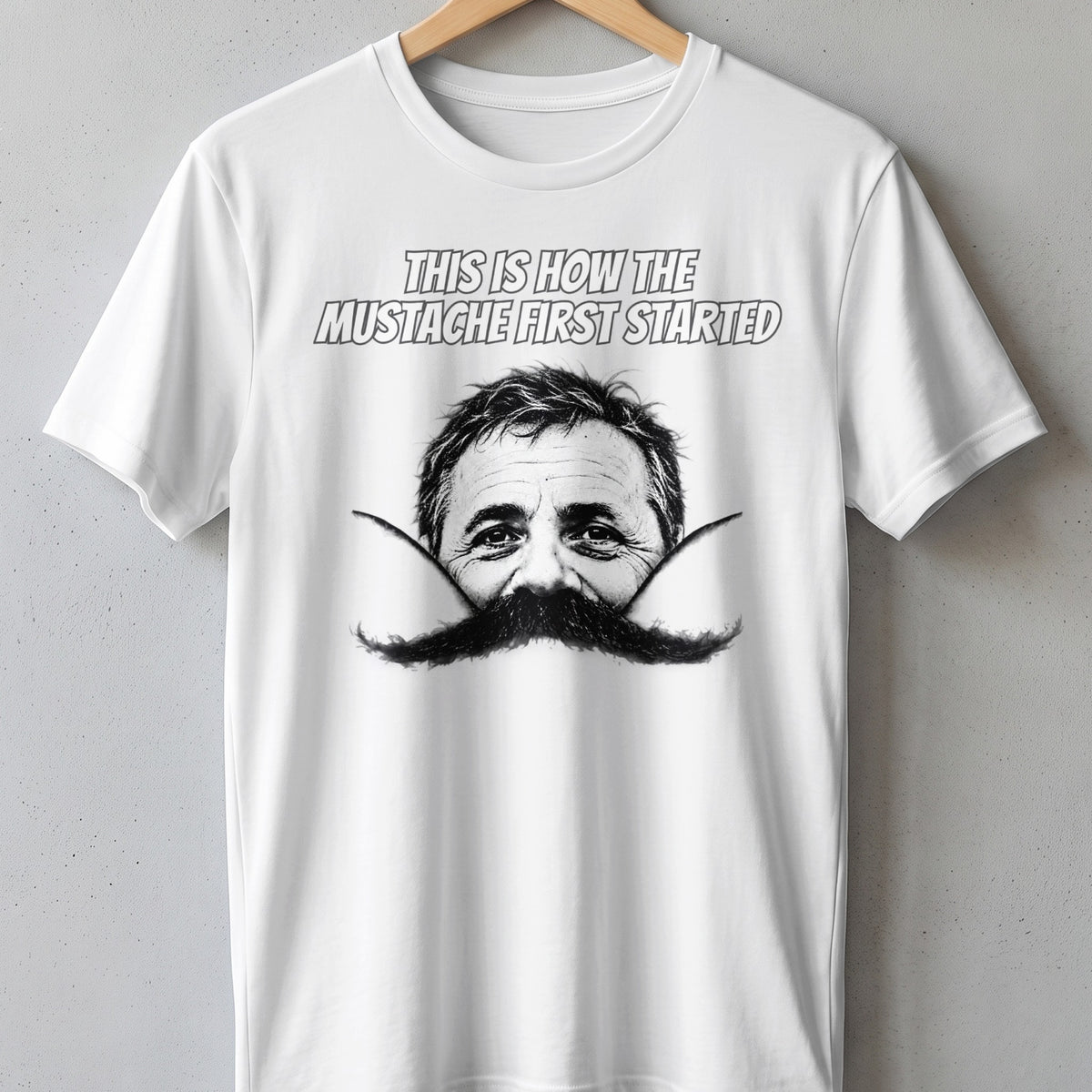 White t-shirt with black and white graphic of a man's face and mustache.