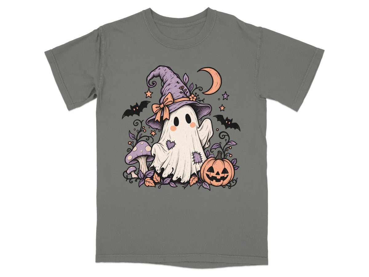 A dark gray t-shirt featuring a cute ghost wearing a witch hat, surrounded by pumpkins, bats, and mushrooms.