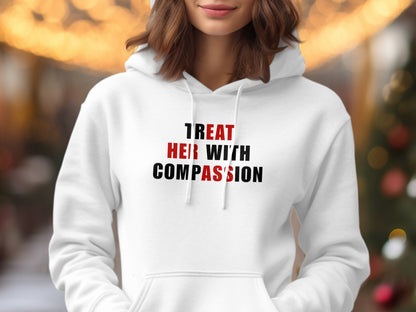 White hoodie with "TREAT HER WITH COMPASSION" text in red and black.