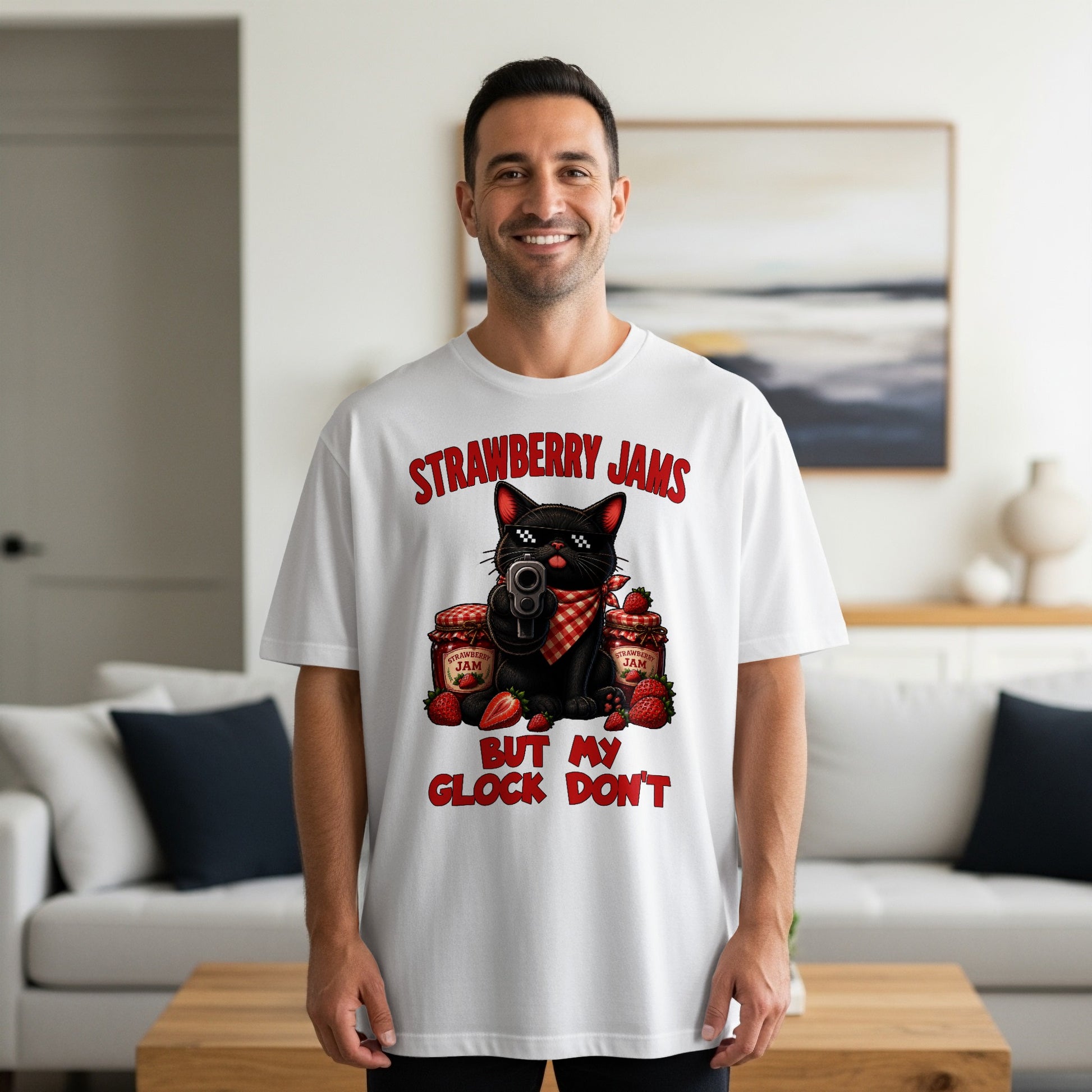 Black cat with sunglasses and gun on t-shirt, surrounded by strawberry jam jars and strawberries.