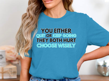 Blue t-shirt with text "YOU EITHER QUIT OR KEEP GOING THEY BOTH HURT CHOOSE WISELY".
