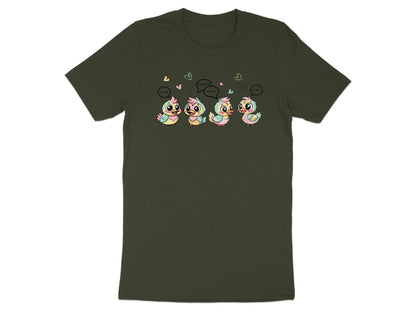 Four cartoon ducklings with speech bubbles, one saying "Quack", on a dark green t-shirt.