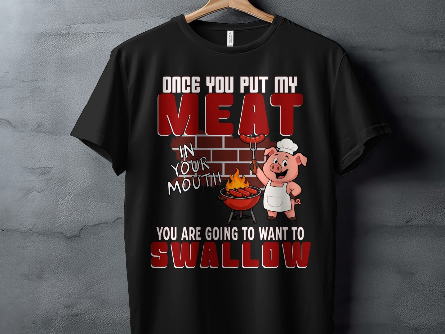 Black t-shirt with pig grilling and text "Once you put my meat in your mouth you are going to want to swallow".