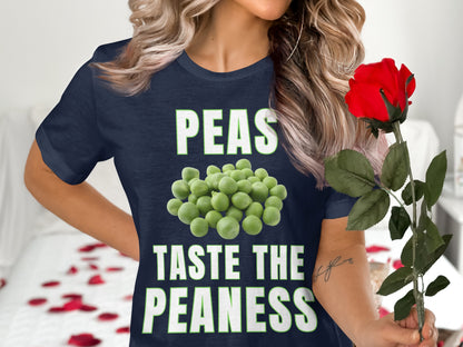 Navy t-shirt with green text and peas graphic reading "PEAS TASTE THE PEANESS".