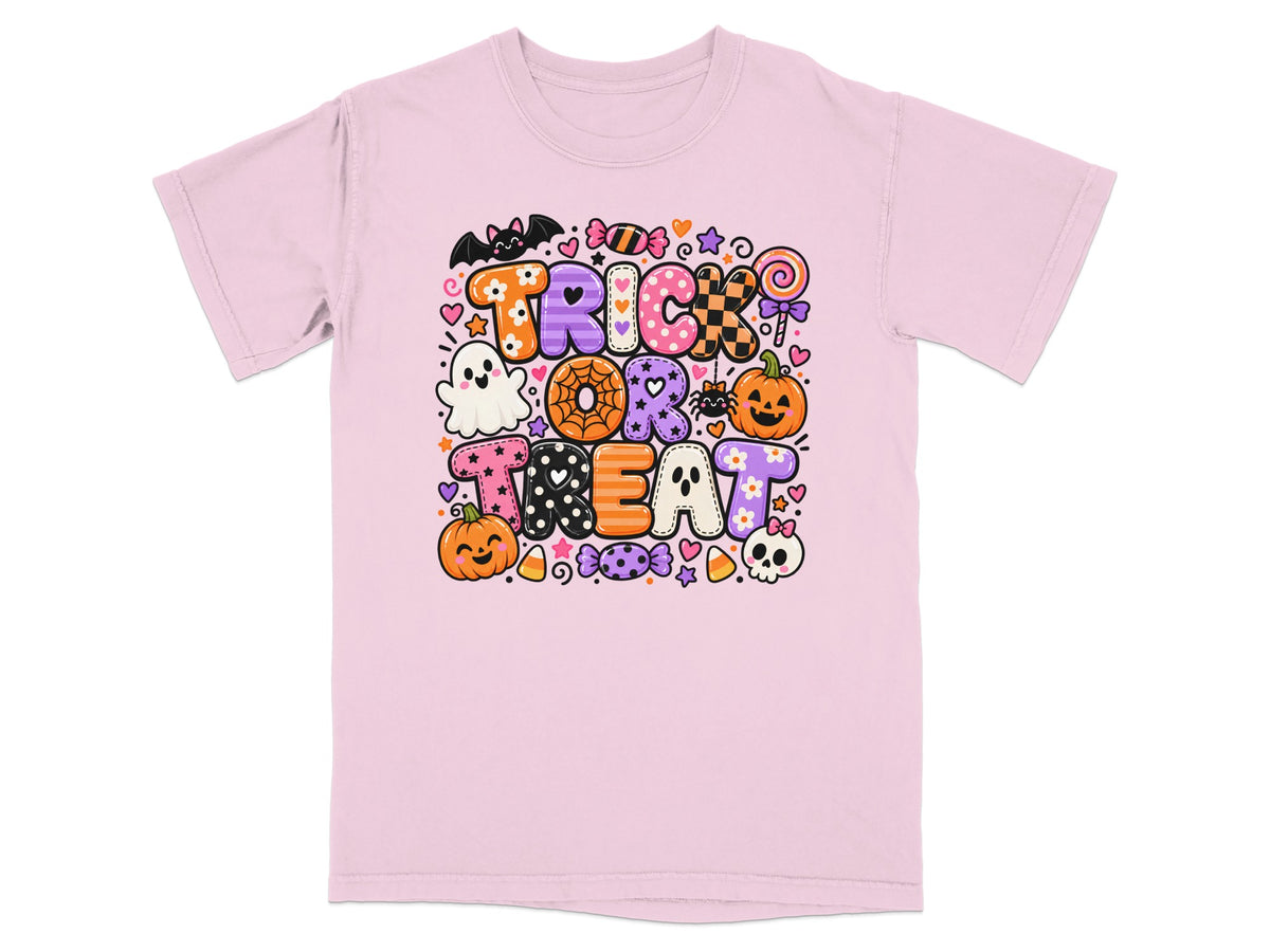 Pink t-shirt with "Trick or Treat" text featuring pumpkins, ghosts, bats, and candy.