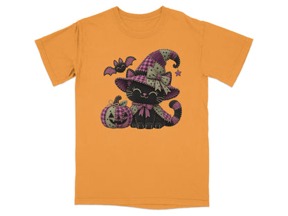 Black cat in witch hat with pumpkin and bat on orange t-shirt.